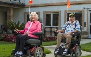 A couple using electric wheelchairs